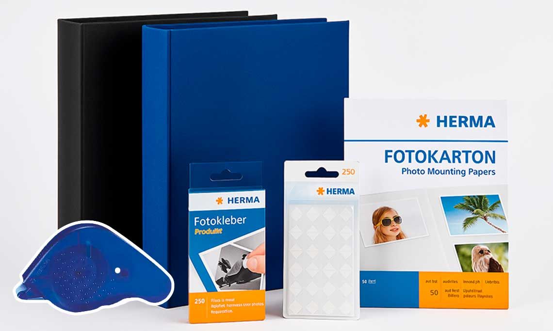 Herma archival photo albums and adhesive mounting products on white background.