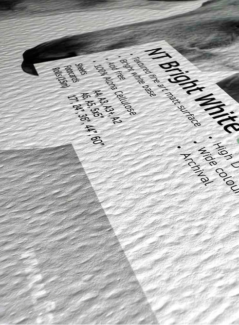 Corner detail of Natural Textured Bright White 315 paper